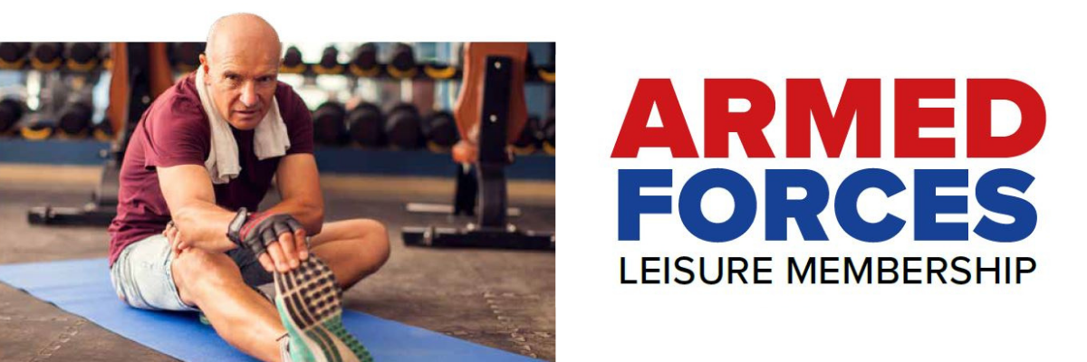 Armed Forces Leisure Membership. Image of a man sitting on the gym floor stretching his leg